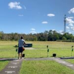 A group of trapshooters on a trap field at Gulf Coast Clays